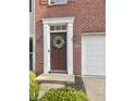 Close-up of the front door, showcasing a wreath and well-manicured entrance at 6927 Havenmoor Pl, Indianapolis, IN 46250