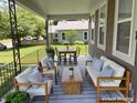 The front porch is furnished with comfortable seating, perfect for relaxing at 706 N Euclid Ave, Indianapolis, IN 46201
