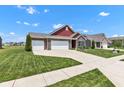 Beautiful single-Gathering home with brick accents, three-car garage, and a lush green lawn at 8044 Yarmouth Way, Indianapolis, IN 46239