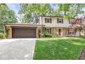 Traditional two-story brick and siding home with an attached two-car garage at 9221 Holyoke Ct, Indianapolis, IN 46268