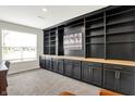 Stylish office featuring custom built-in shelving, cabinetry, and ample natural light at 9716 Cimmaron Ave, McCordsville, IN 46055