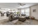 Open-concept living room and kitchen with hardwood floors and natural lighting at 10273 Haag Rd, Brownsburg, IN 46112