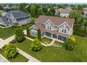 Beautiful home with mature trees and landscaping nestled in a picturesque neighborhood at 1102 Clearwell Dr, Greenwood, IN 46143