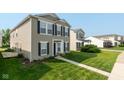 A cozy home exterior featuring a well-manicured lawn and charming curb appeal at 12671 Endurance Dr, Fishers, IN 46037