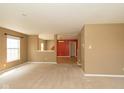 A cozy living room featuring neutral walls, carpet flooring and lots of natural light at 12671 Endurance Dr, Fishers, IN 46037