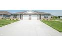 A well-maintained home with a double garage and a long driveway at 1452 Coen Ct, Columbus, IN 47201