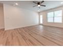 A spacious living room featuring vinyl floors, and a ceiling fan at 1452 Coen Ct, Columbus, IN 47201