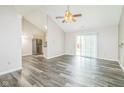 Spacious living room features an open floor plan, high ceilings, neutral paint, and sliding glass doors at 14911 Silver Thorne Way, Carmel, IN 46033
