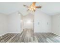 Spacious living room features an open floor plan, high ceilings, neutral paint, and sliding glass doors at 14911 Silver Thorne Way, Carmel, IN 46033