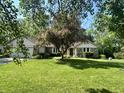 Lawn view of a home with attractive landscaping including healthy green grass and a mature tree at 177 Wellington Pkwy, Noblesville, IN 46060