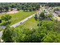 Aerial view of property close to a baseball field, shopping area, and a tree-lined neighborhood at 2710 W State Road 38, Sheridan, IN 46069