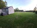 Expansive backyard offering plenty of room and a view of the adjacent baseball field from the rear at 2710 W State Road 38, Sheridan, IN 46069