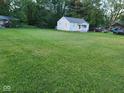 Charming home with a large front lawn and ample parking space; great curb appeal at 2710 W State Road 38, Sheridan, IN 46069