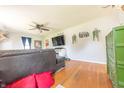 Open living room boasting hardwood floors, cozy furniture, and ample natural light at 272 Jefferson St, Columbus, IN 47201