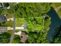 Aerial view of wooded lot featuring mature trees with a lake on property at 2805 Fox E Ct, Martinsville, IN 46151