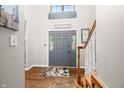 Inviting foyer featuring hardwood floors, staircase and neutral paint throughout at 2805 Fox E Ct, Martinsville, IN 46151