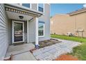 Cozy front porch with a welcome mat, charming decor, and a tidy walkway at 2887 Ludwig Dr, Indianapolis, IN 46239