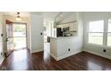 Bright entryway featuring hardwood floors with easy access to the kitchen, breakfast bar and living areas at 2905 Inverrary Ct, Indianapolis, IN 46234