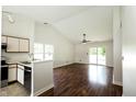 Bright open concept featuring an eat-in kitchen and a large living area with hardwood floors at 2905 Inverrary Ct, Indianapolis, IN 46234