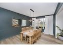 Traditional dining room featuring modern lighting, stylish decor, and a window with natural light at 3876 Kegler Way, Carmel, IN 46074