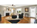 Inviting living room featuring a fireplace, hardwood floors, and ample natural light at 3940 E 57Th St, Indianapolis, IN 46220