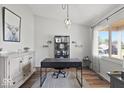 Bright home office featuring wood floors, large window, and neutral decor creating a productive workspace at 4605 Clairmont Dr, Columbus, IN 47203