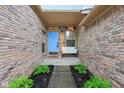 Charming front porch with a light blue door and ample space to sit and relax at 4933 Common Vista Way, Indianapolis, IN 46220
