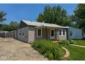 Single story home with front porch and lovely landscaping at 5866 Shimer Ave, Indianapolis, IN 46219