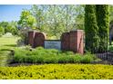 The Eagle Lakes community entrance features brick pillars, decorative landscaping, and a welcoming sign at 6027 Bluecrest Dr, Brownsburg, IN 46234