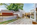 Wooden deck area provides a relaxing outdoor space, adjacent to the detached garage at 615 Orange St, Indianapolis, IN 46203