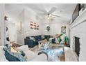 Cozy living room featuring a fireplace, vaulted ceiling, and comfortable seating at 6933 Grey Wolf Dr, , IN 46164