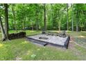 Relaxing outdoor fire pit area with seating, perfect for entertaining guests at 7074 E Pine Needle Ln, Morgantown, IN 46160
