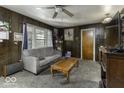 Inviting living room with wood paneling and a cozy atmosphere at 719 Melvenia St, Indianapolis, IN 46219