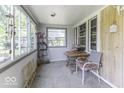 Relaxing sunroom with lots of natural light and windows, perfect for morning coffee at 719 Melvenia St, Indianapolis, IN 46219