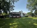 Expansive backyard featuring a deck and fence, perfect for outdoor living and entertaining at 723 Bennett Rd, Carmel, IN 46032