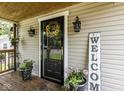 Inviting front porch with decorative flower pots and seasonal sunflower wreath at 730 N Forsythe St, Franklin, IN 46131