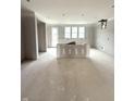 Spacious, unfinished living area with recessed lighting and multiple windows at 7305 Bayview Run # 13-605, McCordsville, IN 46055