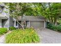 Inviting home exterior with a well-manicured lawn and an attached garage at 7803 Harbour, Indianapolis, IN 46240