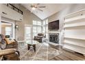 Bright living room with vaulted ceilings, fireplace, and large windows at 7803 Harbour, Indianapolis, IN 46240