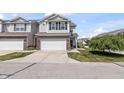 Inviting townhouse showcasing a well-maintained facade and convenient attached garage at 9709 Prairie Smoke Dr, Noblesville, IN 46060