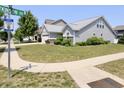 Landscaped front lawn with view of home featuring vinyl siding at 10628 Bali Ct, Noblesville, IN 46060