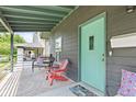 Inviting front porch with seating area and stylish decor, perfect for relaxing at 1205 N Temple Ave, Indianapolis, IN 46201