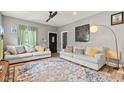 Cozy living room with comfortable seating, stylish rug, and plenty of natural light at 1205 N Temple Ave, Indianapolis, IN 46201