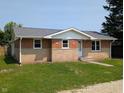 Lovely one-story brick house featuring a well-groomed lawn at 1359 S Mulberry St, Martinsville, IN 46151