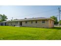 Large, well-maintained backyard with a concrete patio and plenty of space for outdoor activities at 1460 W Mckay Rd, Shelbyville, IN 46176