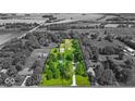 Aerial shot showcases property layout, outlining the home, pool, and surrounding landscape at 14918 E 206Th St, Noblesville, IN 46060
