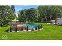 Backyard featuring a pool with deck, perfect for outdoor relaxation and entertaining at 14918 E 206Th St, Noblesville, IN 46060