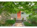 Exterior view of the home showing the front door, address number, and landscaping at 2233 Washington St, Columbus, IN 47201