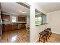 Kitchen view showcasing wood cabinets, modern appliances, and a breakfast bar area at 29 Northview Dr, Danville, IN 46122