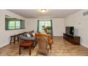 Inviting living room featuring wood floors, comfortable seating, and natural light from large windows at 29 Northview Dr, Danville, IN 46122